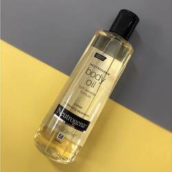 Neutrogena body oil - Light Sesame Formula (ប្រេងផ្ដល់សំណើមដងខ្លួន) 250ml